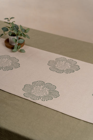 The Green Dhaliya table runner in handwoven fabric